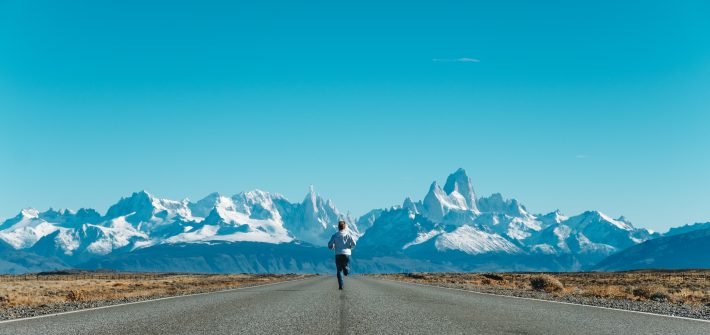 person running on road at daytime